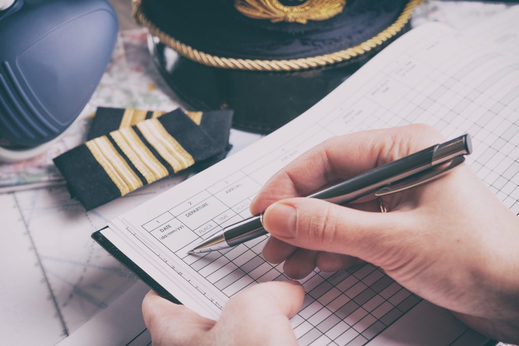 Airplane pilot filling in flight plan